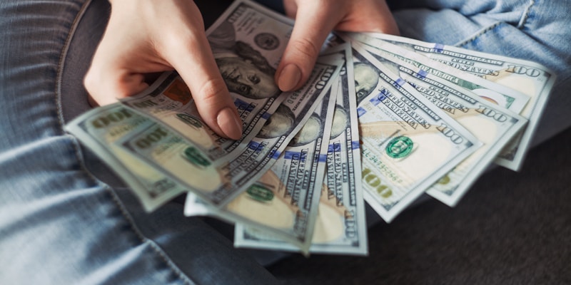 Writing notes about smart money habits in a journal